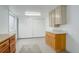 The unfinished basement includes storage cabinets with counter space and a window at 1428 S County Road 23E, Berthoud, CO 80513