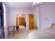 Light purple bedroom with hardwood doors and tan carpet at 1428 S County Road 23E, Berthoud, CO 80513