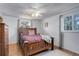 Cozy bedroom featuring a comfortable bed, hardwood floors and bright windows at 1428 S County Road 23E, Berthoud, CO 80513