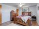 Comfortable bedroom featuring a stylish bed frame, hardwood floors and natural light at 1428 S County Road 23E, Berthoud, CO 80513
