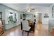 Bright dining room with a large window seat and hardwood floors at 1428 S County Road 23E, Berthoud, CO 80513