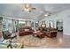 Bright living room featuring hardwood floors, comfortable sofas, and large windows with scenic views at 1428 S County Road 23E, Berthoud, CO 80513