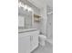 Bathroom with a white vanity, granite countertop, subway tile shower, and gold accents at 1270 Winona Ct, Denver, CO 80204