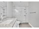Modern bathroom featuring a glass-enclosed shower with white subway tile and a granite countertop at 1270 Winona Ct, Denver, CO 80204