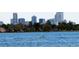 View of the city skyline from the open water at 1270 Winona Ct, Denver, CO 80204