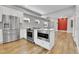 Modern kitchen featuring stainless steel appliances and an island with seating at 1270 Winona Ct, Denver, CO 80204