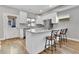 Bright kitchen with a large island, stainless steel appliances, and modern countertops at 1270 Winona Ct, Denver, CO 80204