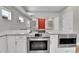 Modern kitchen featuring stainless steel appliances and a large island at 1270 Winona Ct, Denver, CO 80204
