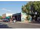 Unique storefront with colorful mural art, black awnings, and street parking at 1270 Winona Ct, Denver, CO 80204
