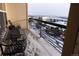 Private balcony overlooking snowy neighborhood at 10111 Inverness Main St # 425, Englewood, CO 80112