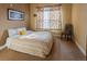 Bright bedroom with neutral decor and ample natural light at 10111 Inverness Main St # 425, Englewood, CO 80112