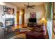 Living room features hardwood floors, fireplace, and comfy seating at 10111 Inverness Main St # 425, Englewood, CO 80112