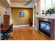 Home office with hardwood floors and built-in shelving at 10111 Inverness Main St # 425, Englewood, CO 80112