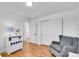 Bedroom with hardwood floors and a rocking chair at 4642 Everett Ct, Wheat Ridge, CO 80033