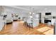 Open-concept kitchen with a large island, stainless steel appliances, and hardwood flooring at 4642 Everett Ct, Wheat Ridge, CO 80033