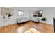 Sunlit living area with hardwood floors and modern furniture at 4642 Everett Ct, Wheat Ridge, CO 80033