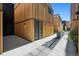Modern townhome with unique wood siding and inviting entrance at 1601 Park Ave # 216, Denver, CO 80218