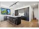 Modern kitchen boasts a large island with seating and sleek cabinetry at 1601 Park Ave # 216, Denver, CO 80218