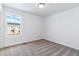 Bright bedroom with a scenic window view, plush carpeting, and painted in neutral tones at 3324 N Catawba Way, Aurora, CO 80019