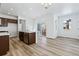 Well-lit kitchen with an island, modern appliances, and plenty of countertop space at 3324 N Catawba Way, Aurora, CO 80019