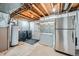 Laundry and storage area in the basement at 11919 E Yale Ave, Aurora, CO 80014