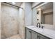 Basement bathroom with shower and vanity at 11919 E Yale Ave, Aurora, CO 80014