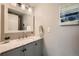 Modern bathroom with gray vanity and granite countertop at 11919 E Yale Ave, Aurora, CO 80014