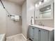 Updated bathroom, featuring a shower and new vanity at 11919 E Yale Ave, Aurora, CO 80014