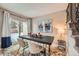 Bright dining room with a modern table and sliding glass doors to a patio at 11919 E Yale Ave, Aurora, CO 80014