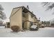 Tan siding townhouse exterior in winter at 11919 E Yale Ave, Aurora, CO 80014