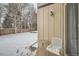 Small patio with chair and table, snowy yard at 11919 E Yale Ave, Aurora, CO 80014