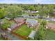 A home's aerial view shows a backyard with a patio and green lawn in a residential neighborhood at 2681 Leyden St, Denver, CO 80207