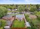 An aerial view of a home with a grassy backyard, brick shed, and patio furniture at 2681 Leyden St, Denver, CO 80207