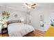 Cozy bedroom with hardwood floors, bright lighting, and minimalist décor at 2681 Leyden St, Denver, CO 80207