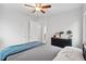 Comfortable bedroom with a ceiling fan and a gray and blue bedspread at 2681 Leyden St, Denver, CO 80207