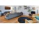 Cozy living room with hardwood floors, area rug, stylish furniture, and natural light at 2681 Leyden St, Denver, CO 80207