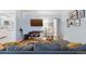 Spacious living room with tv, hardwood floors and comfortable seating at 2681 Leyden St, Denver, CO 80207