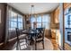 Bright breakfast nook with large windows and a charming chandelier at 2543 Eastview Dr, Castle Rock, CO 80104