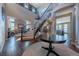 Spacious entryway with a curved staircase and high ceilings at 2543 Eastview Dr, Castle Rock, CO 80104