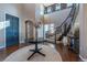 Bright and airy entryway with a grand staircase at 2543 Eastview Dr, Castle Rock, CO 80104