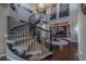 Grand entryway with a curved staircase and hardwood floors at 2543 Eastview Dr, Castle Rock, CO 80104