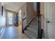 Spacious entryway with tile flooring, bench seating, and stairs leading to the upper level at 2543 Eastview Dr, Castle Rock, CO 80104