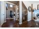 Bright entryway with hardwood floors and views to the living room and stairway at 2543 Eastview Dr, Castle Rock, CO 80104