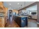 Open kitchen with large island, granite countertops, and hardwood floors at 2543 Eastview Dr, Castle Rock, CO 80104