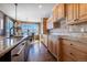 Bright kitchen boasts granite countertops, ample cabinetry, and views from the window at 2543 Eastview Dr, Castle Rock, CO 80104