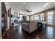 Spacious living room with hardwood floors, fireplace, and expansive windows at 2543 Eastview Dr, Castle Rock, CO 80104