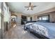 Main bedroom with a large bed, plenty of natural light and a view of the bathroom at 2543 Eastview Dr, Castle Rock, CO 80104