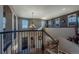 Elegant curved staircase with wrought-iron railing offering a view of the entryway at 2543 Eastview Dr, Castle Rock, CO 80104