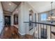 Upper hallway with hardwood floors and views to the lower level at 2543 Eastview Dr, Castle Rock, CO 80104