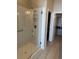 Tiled walk-in shower in a bathroom with walk-in closet at 420 E Fremont Pl # 402, Centennial, CO 80122